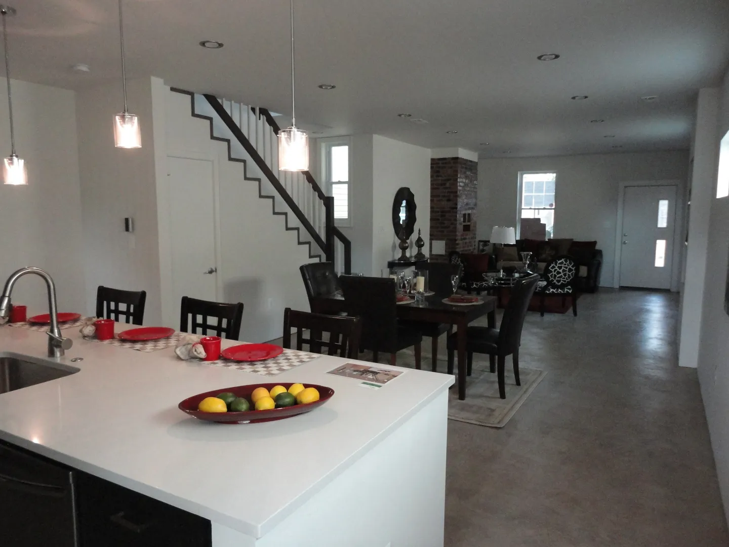 A kitchen with a dining room table and chairs.